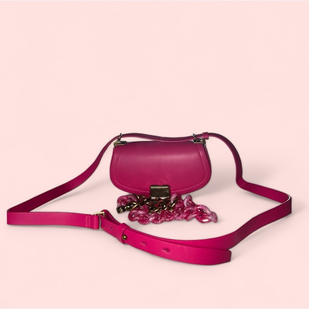 Charles & Keith fuchsia colored leather. This bag is soo coquette! A Statement!!